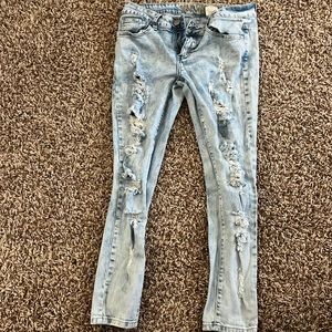 Light ripped jeans one of the belt loops is ripped